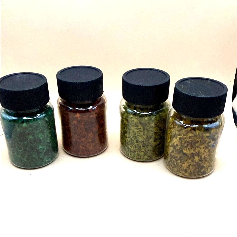 Set of Four Craft jars of leaves